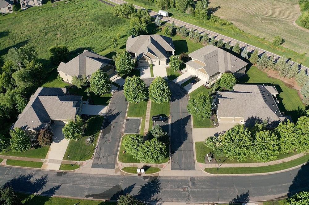 Cul-de-sac cluster of completed association roofs