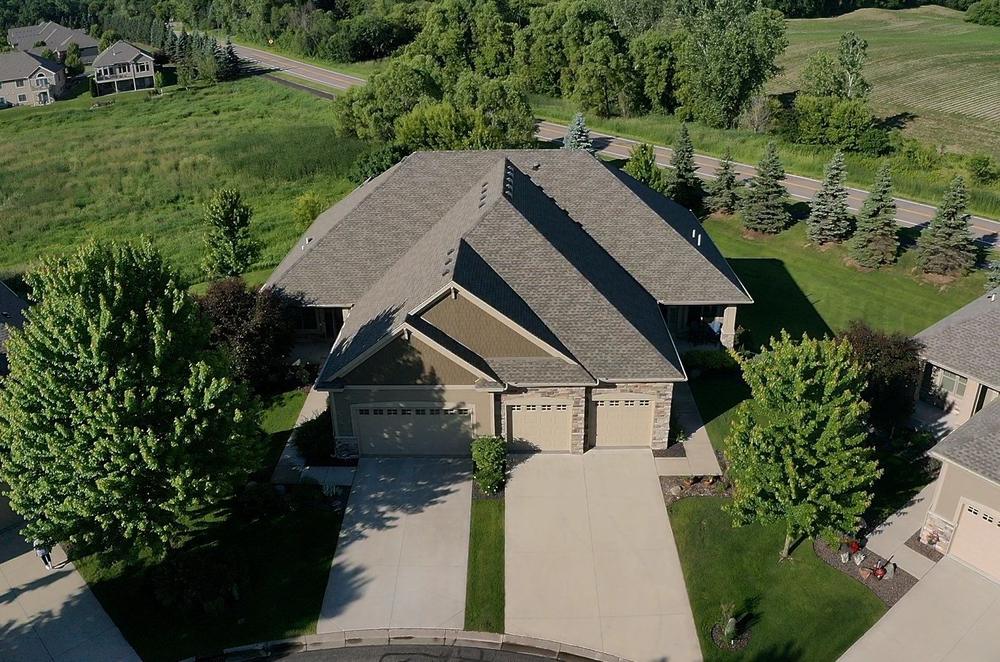 Front aerial of a completed roof and stone entry