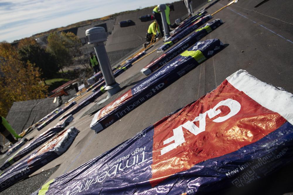 GAF Timberline HDZ bundles staged on an association roof